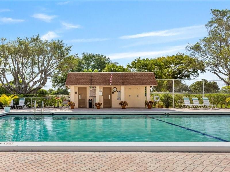 6200 Northwest 2nd Avenue, Unit 418 Boca Raton, FL 33487 - Photo 5 of 41 front view of a house with a yard