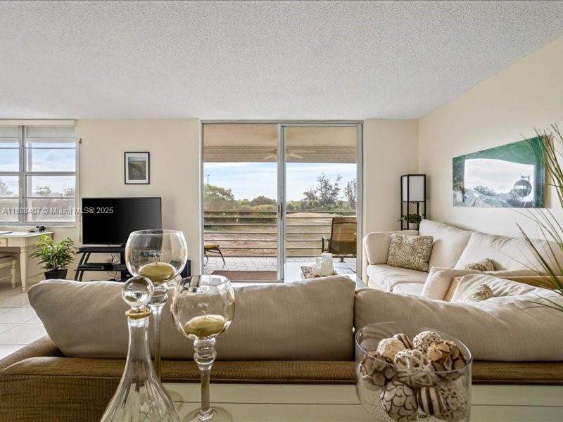 6200 Northwest 2nd Avenue, Unit 418 Boca Raton, FL 33487 - Photo 7 of 41 a living room with furniture and a large window