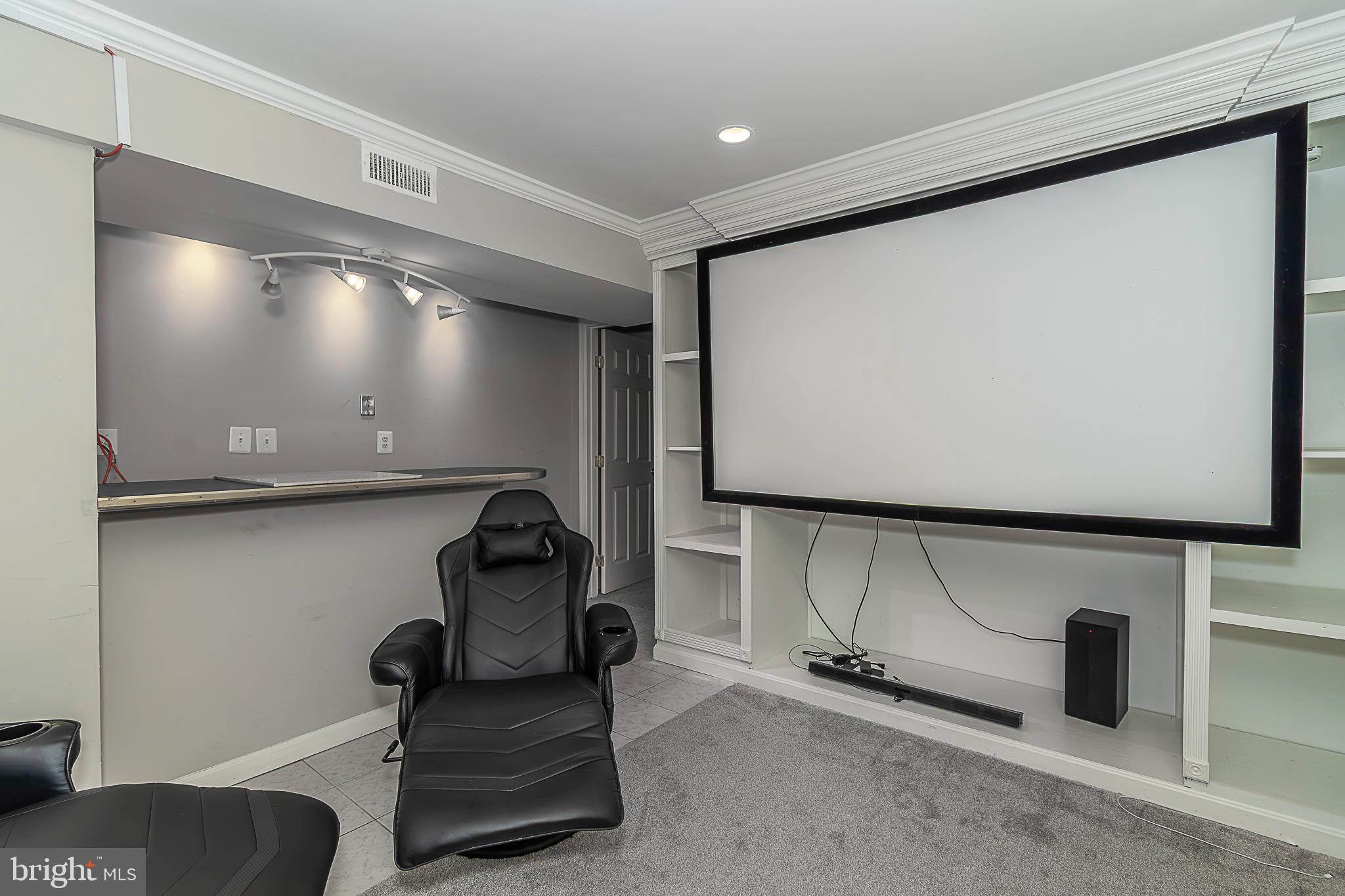 15521 Wheatfield Road Woodbridge, VA 22193 - Photo 37 of 39 Basement rec rm with a wet bar