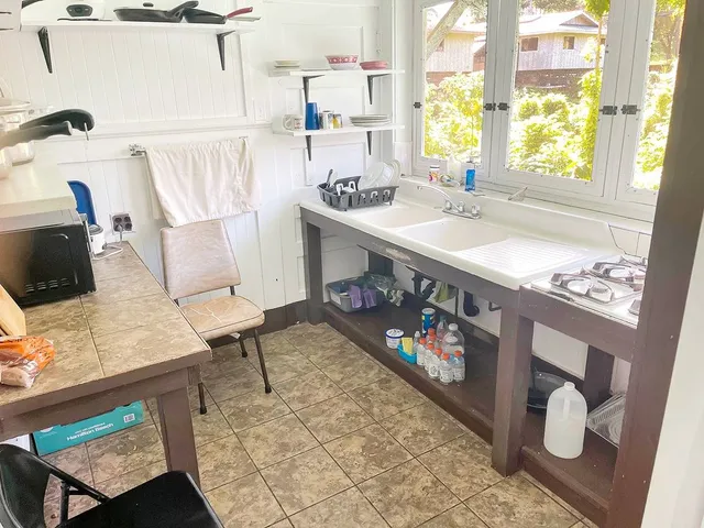 a bathroom with a sink mirror and a bathtub