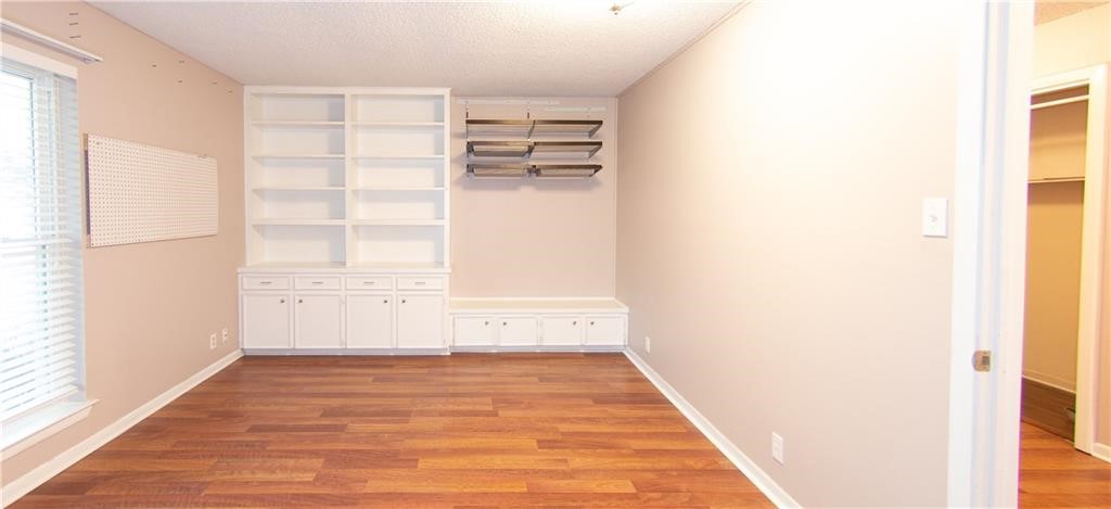 7000 Greenock Street Austin, TX 78749 - Photo 11 of 22 a view of empty room with wooden floor