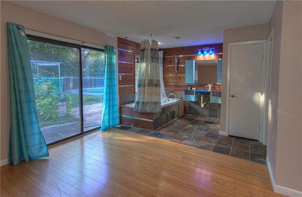 7000 Greenock Street Austin, TX 78749 - Photo 14 of 22 a view of livingroom with furniture and floor to ceiling window