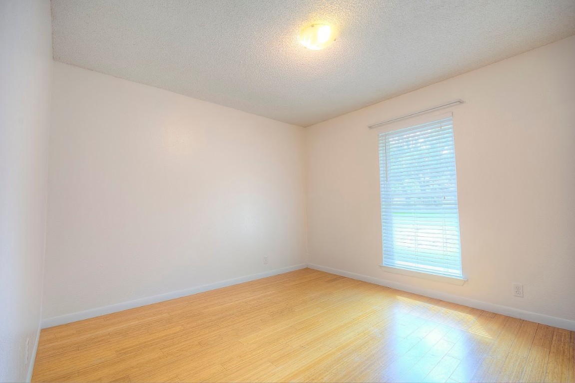 7000 Greenock Street Austin, TX 78749 - Photo 17 of 22 an empty room with a window