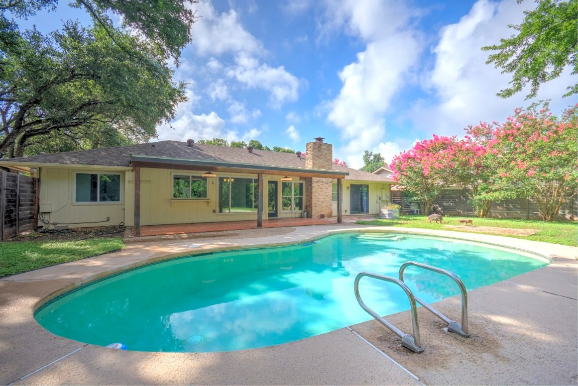 7000 Greenock Street Austin, TX 78749 - Photo 20 of 22 a view of house with swimming pool and a yard