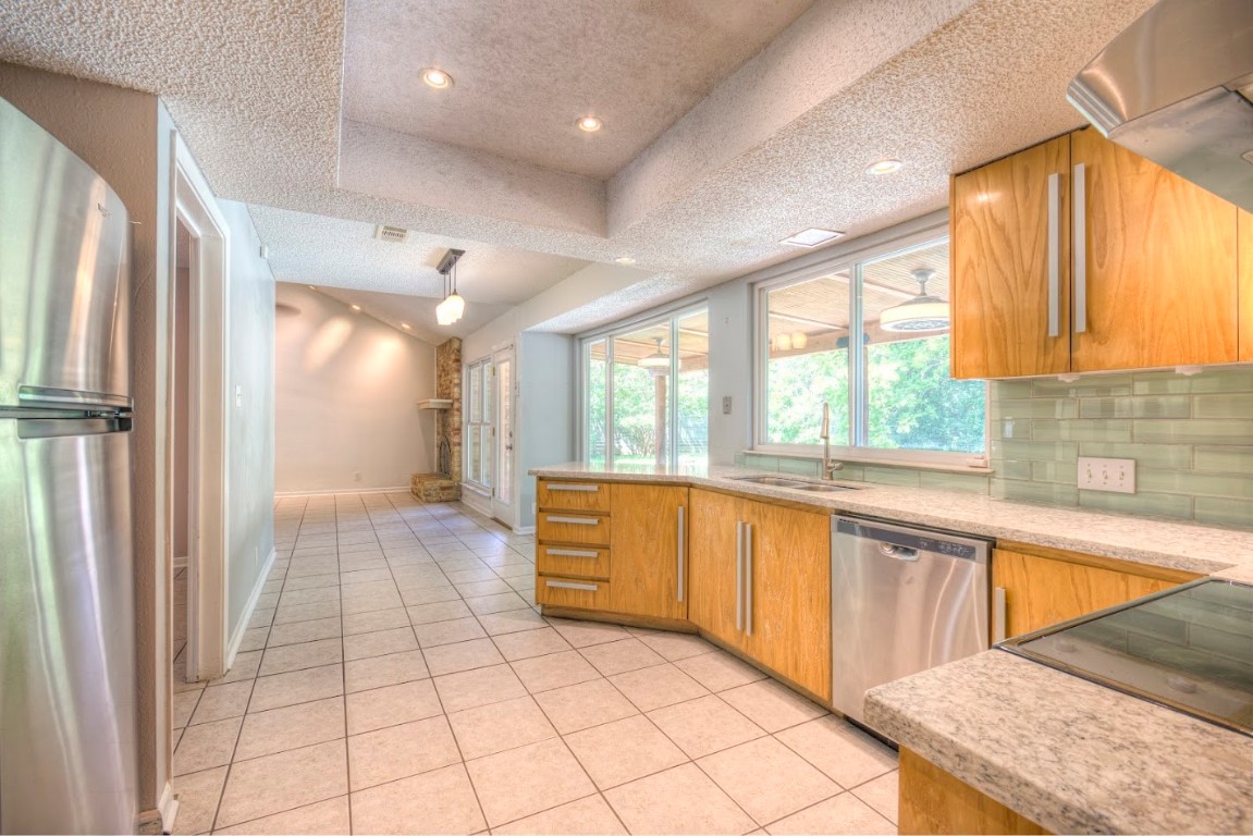 7000 Greenock Street Austin, TX 78749 - Photo 9 of 22 a large white kitchen with a window