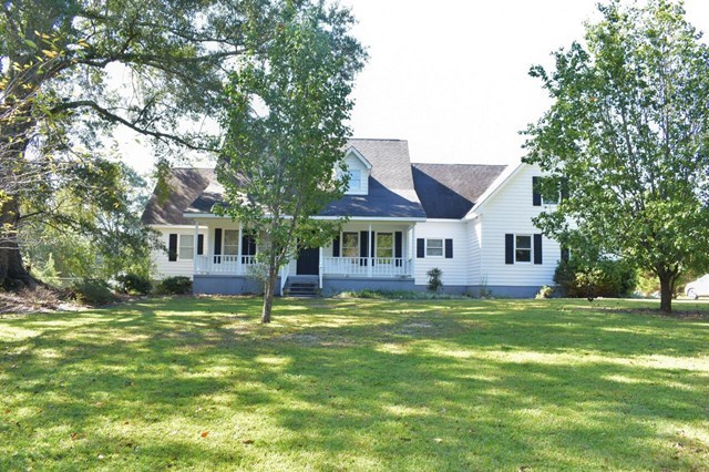 4430 Jones Road Macon, GA 31216 - Photo 2 of 28 a front view of a house with a garden