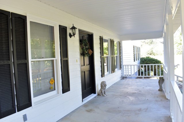 4430 Jones Road Macon, GA 31216 - Photo 4 of 28 a view of a porch with wooden floor and outdoor space