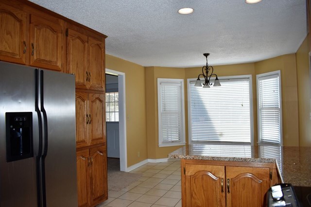 4430 Jones Road Macon, GA 31216 - Photo 6 of 28 a view of hallway with windows and chandelier