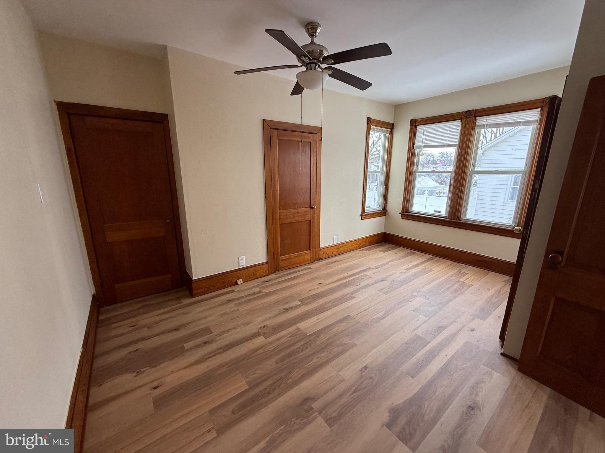 1403 Rancocas Road, Unit 1 Burlington, NJ 08016 - Photo 5 of 9 wooden floor in an empty room with a window