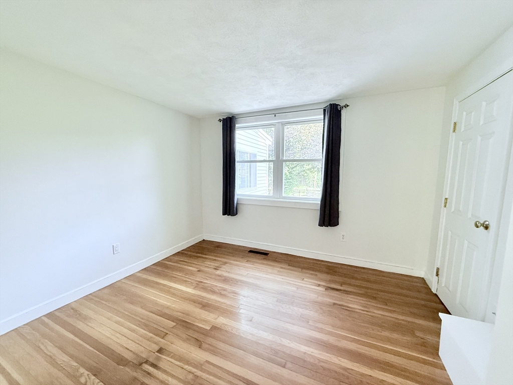 975 South Main Street Bellingham, MA 02019 - Photo 12 of 38 a view of empty room with wooden floor and fan