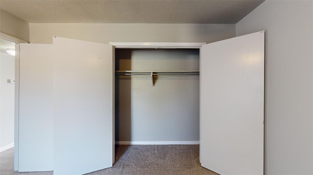 3800 East 29th Street, Unit 15 Bryan, TX 77802 - Photo 11 of 20 a view of walk in closet with empty racks