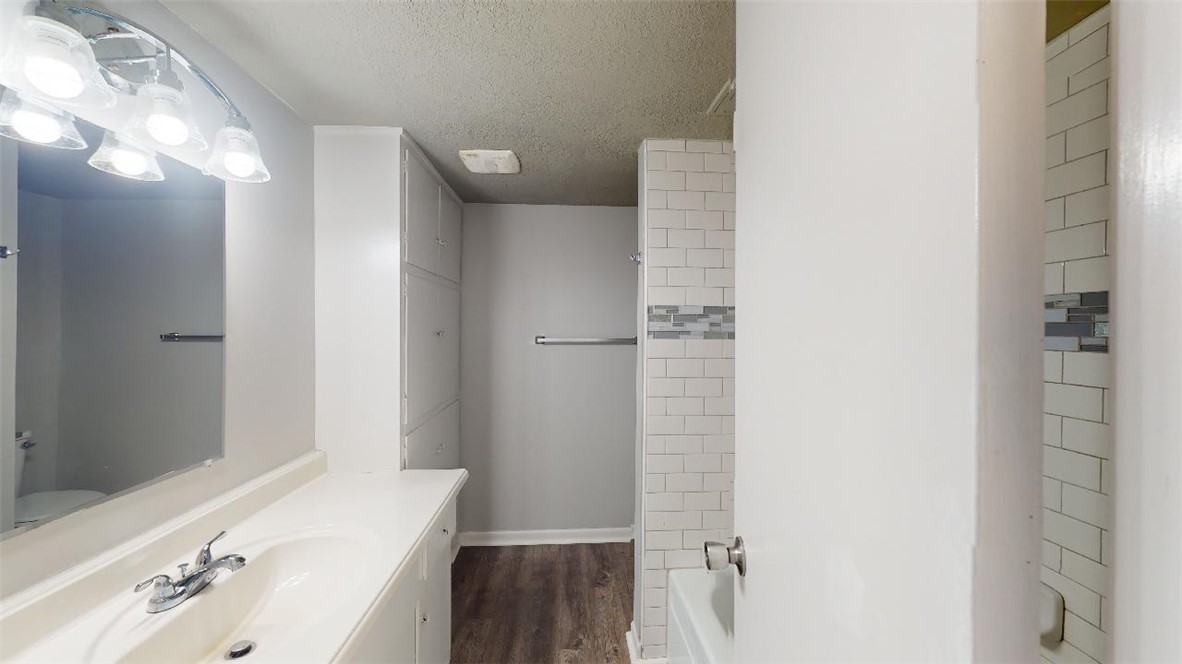 3800 East 29th Street, Unit 15 Bryan, TX 77802 - Photo 15 of 20 a bathroom with a sink and a mirror