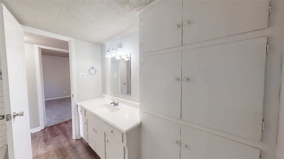 3800 East 29th Street, Unit 15 Bryan, TX 77802 - Photo 16 of 20 a bathroom with a sink a toilet and shower