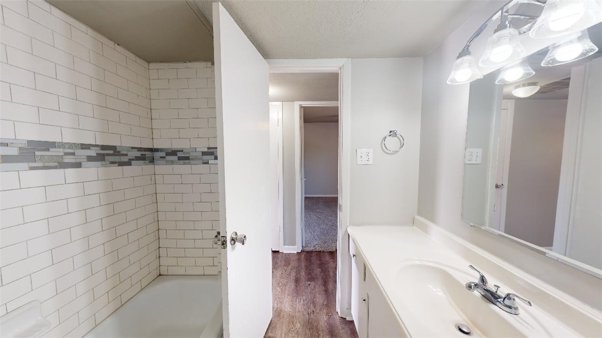3800 East 29th Street, Unit 15 Bryan, TX 77802 - Photo 17 of 20 a bathroom with a bathtub and shower