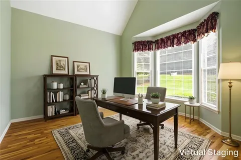 a view of a workspace with furniture