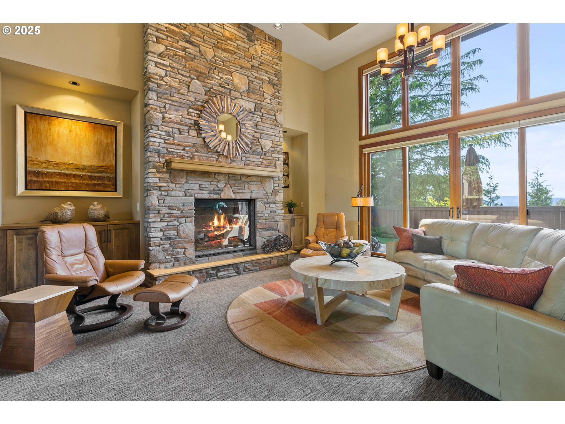 14217 155th Terrace Portland, OR 97224 - Photo 11 of 41 a living room with furniture a fireplace and a floor to ceiling window