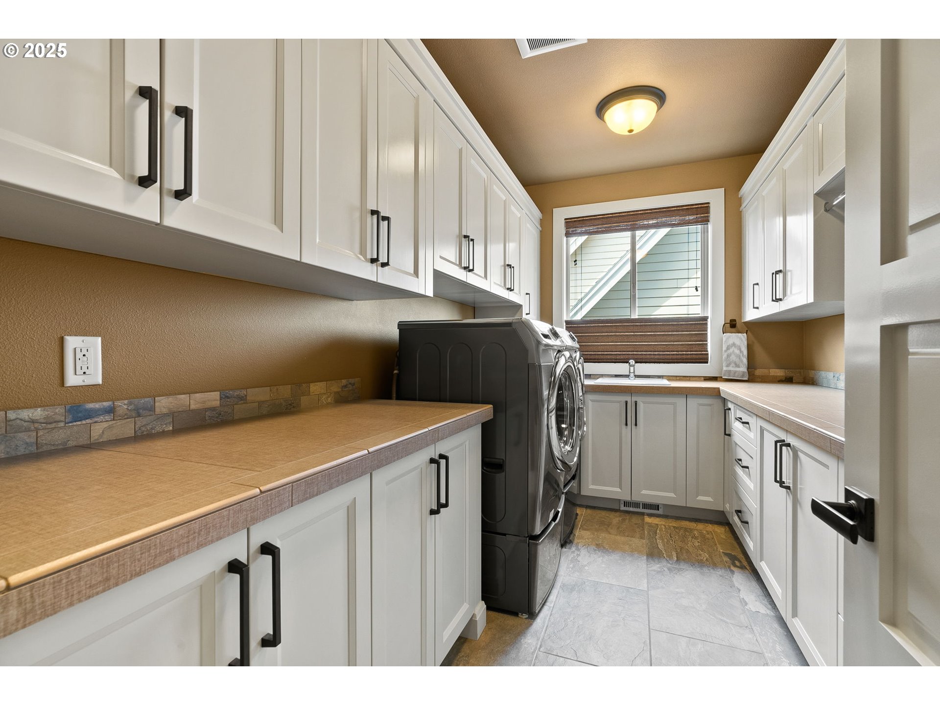 14217 155th Terrace Portland, OR 97224 - Photo 29 of 41 a kitchen with a sink and cabinets