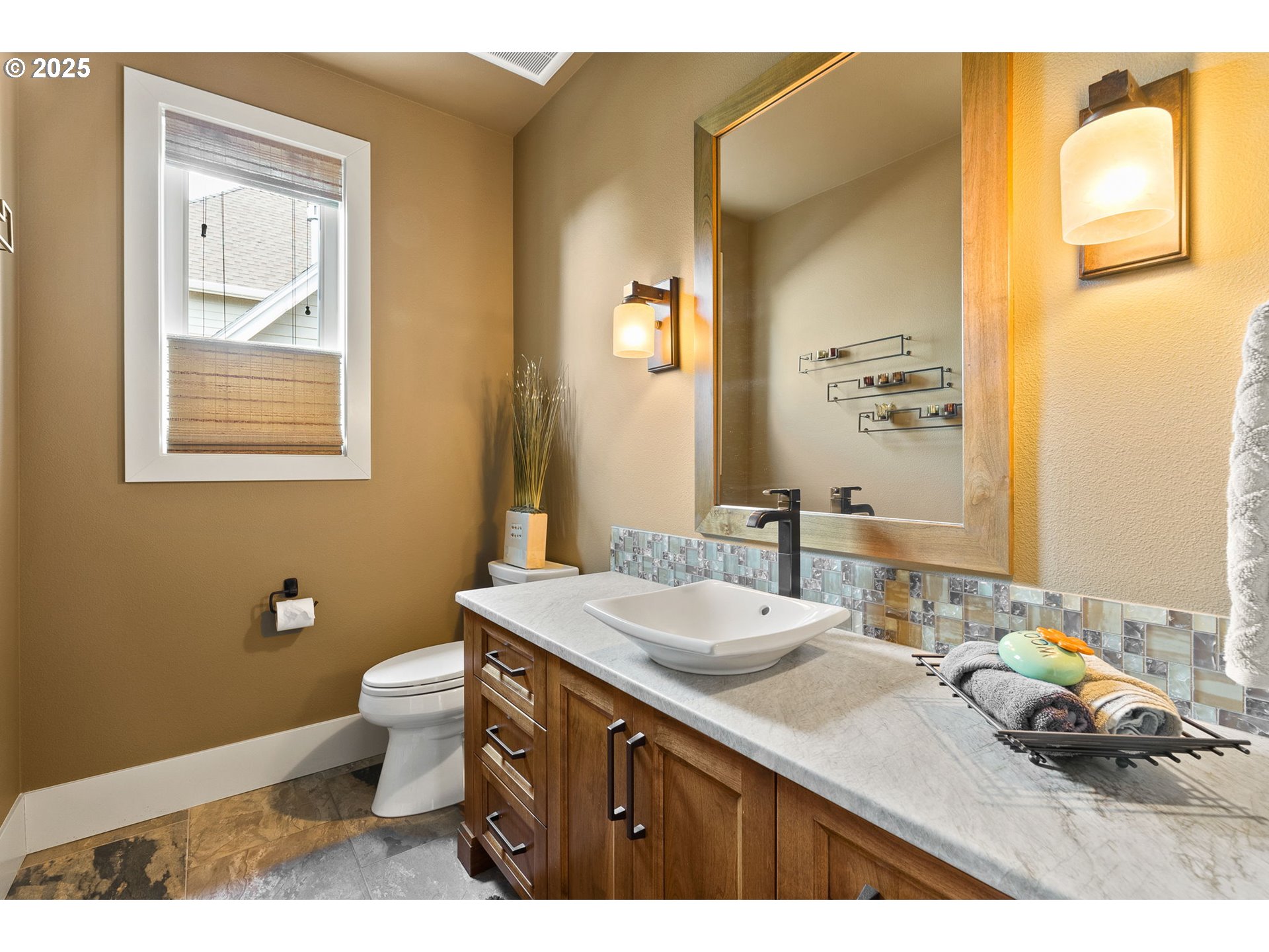 14217 155th Terrace Portland, OR 97224 - Photo 33 of 41 a bathroom with a sink a toilet and mirror
