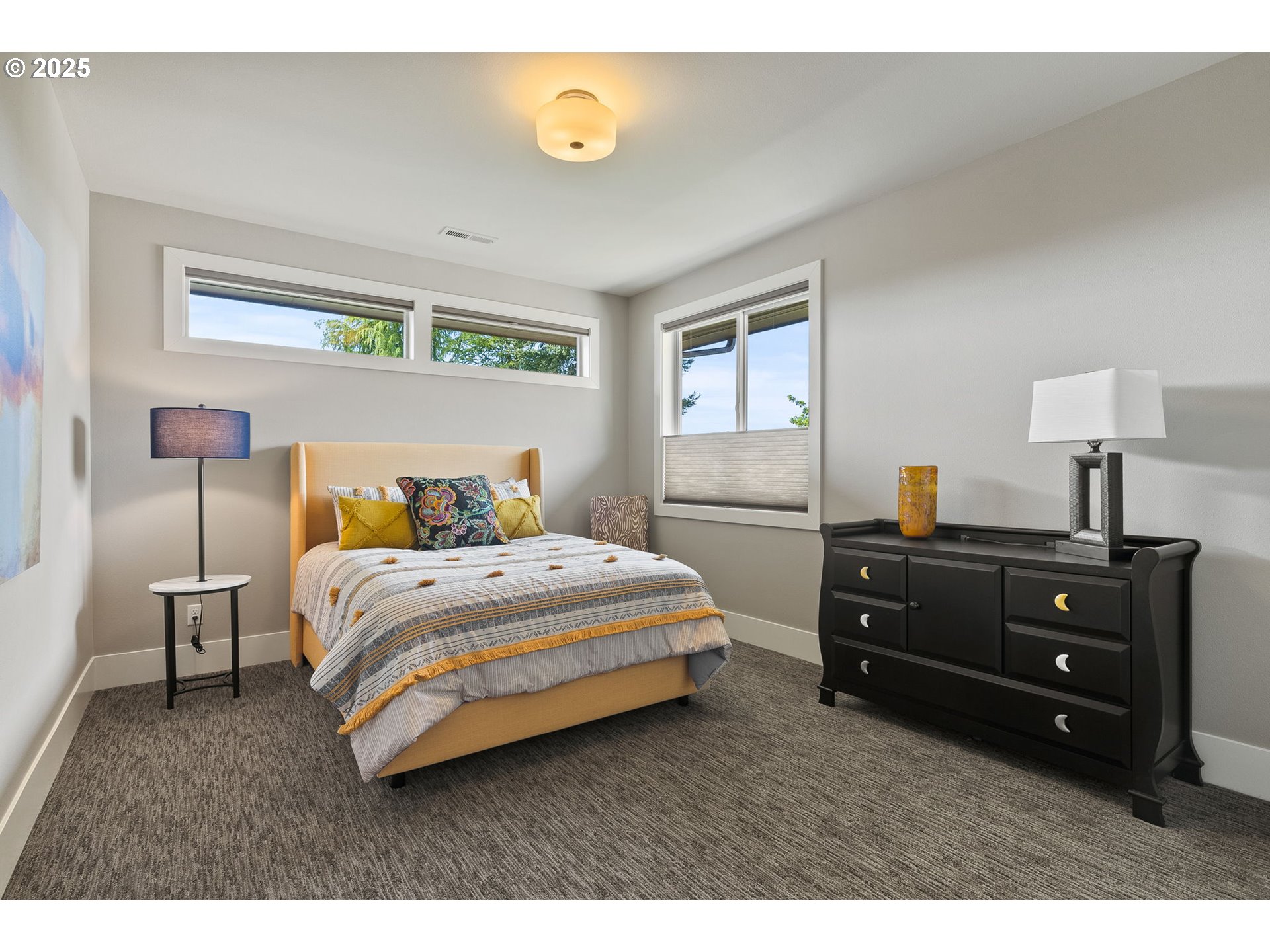 14217 155th Terrace Portland, OR 97224 - Photo 36 of 41 a bedroom with a bed and a lamp