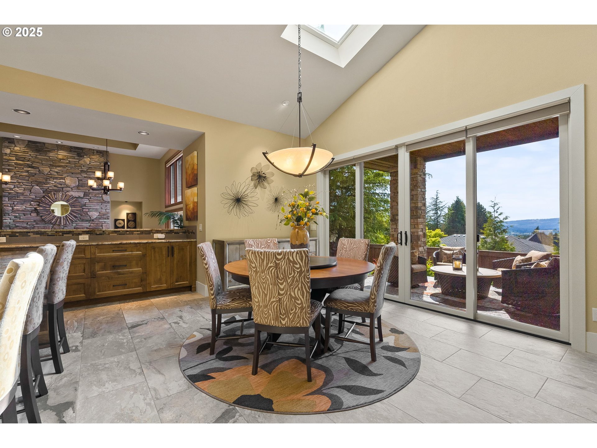 14217 155th Terrace Portland, OR 97224 - Photo 5 of 41 a dining room with furniture a chandelier and a rug