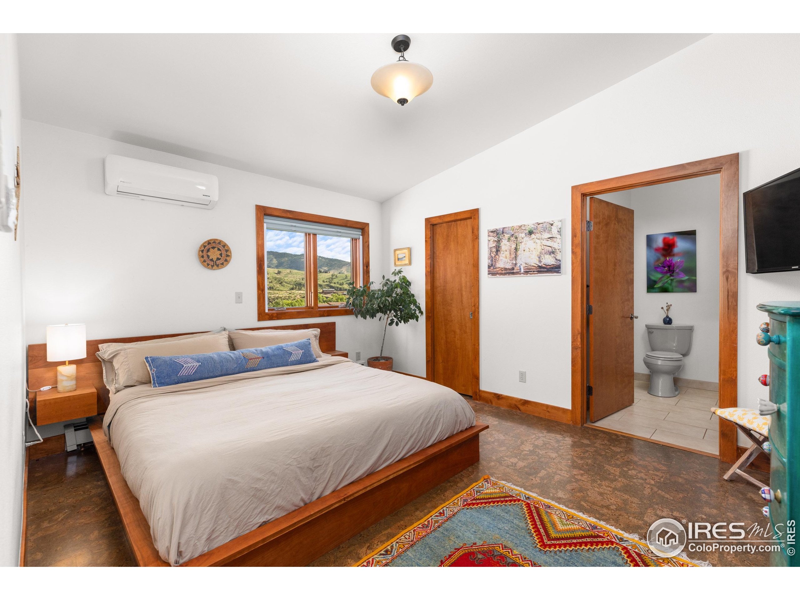 108 Lone Star Road Lyons, CO 80540 - Photo 16 of 38 a bedroom with a bed and a window