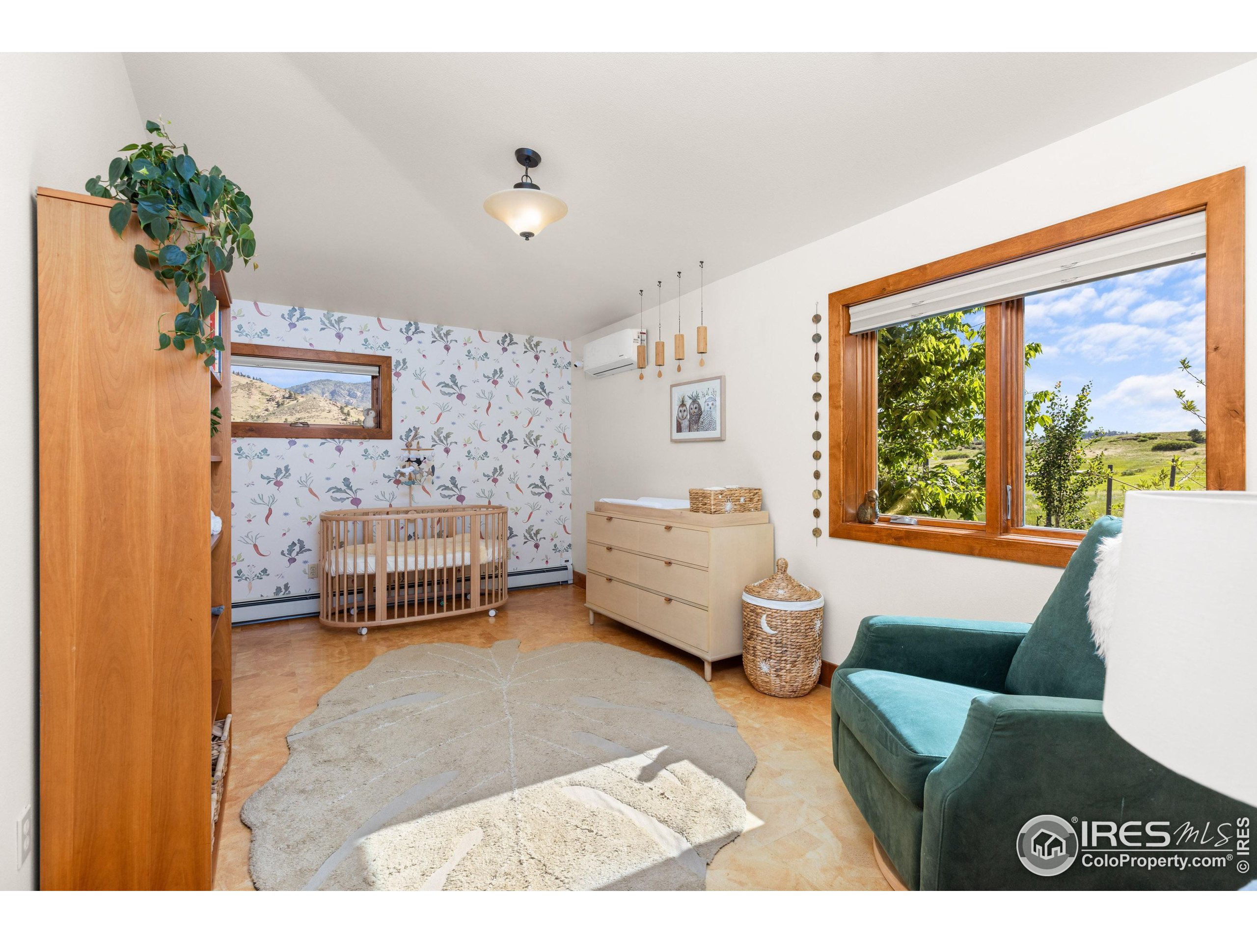 108 Lone Star Road Lyons, CO 80540 - Photo 17 of 38 a bedroom with furniture and a large window