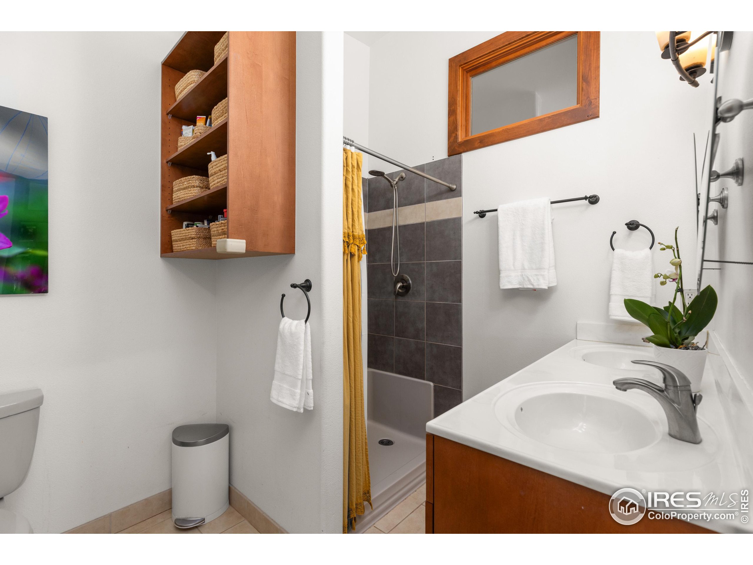 108 Lone Star Road Lyons, CO 80540 - Photo 21 of 38 a bathroom with a sink vanity and a mirror