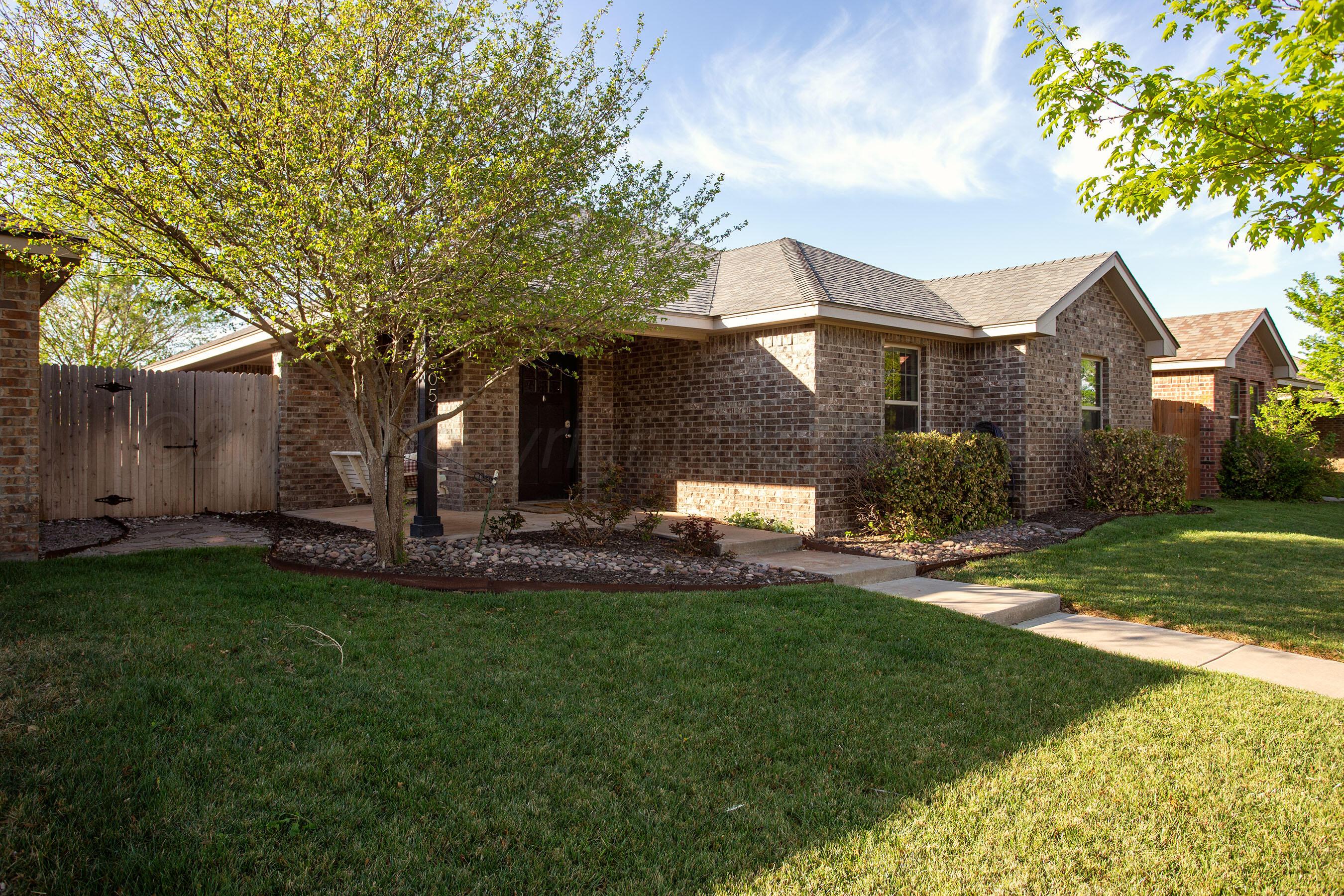 9505 Perry Avenue Amarillo, TX 79119 - Photo 2 of 21 front view of a house with a yard