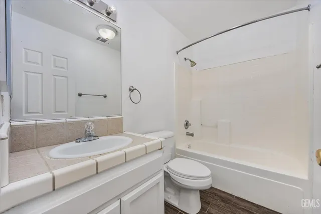 a bathroom with a sink a toilet and a bathtub