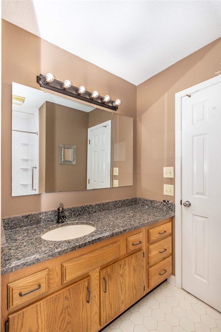 1302 Leeward Road Anderson, SC 29625 - Photo 28 of 50 Functional vanity with ample counter space and storage, illuminated by overhead lighting.