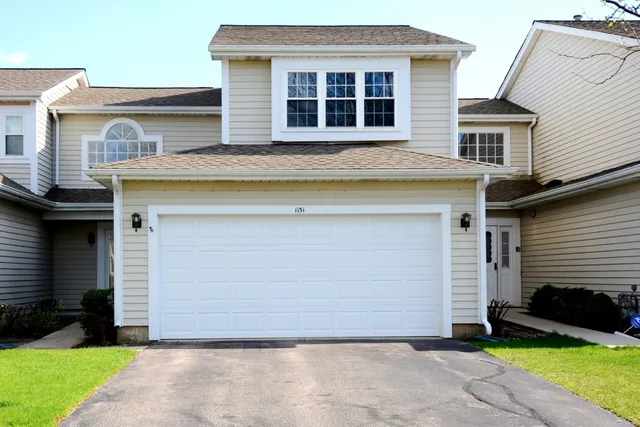 a view of front a house with a yard