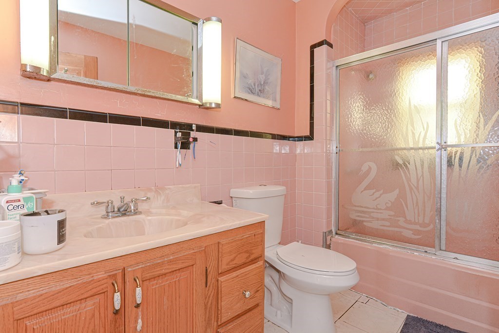 16 Rosedale Avenue Everett, MA 02149 - Photo 23 of 29 a bathroom with a sink a toilet and shower