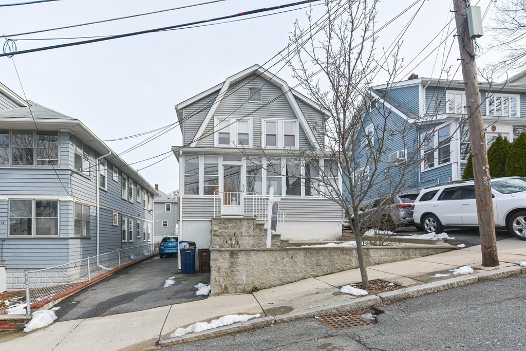 16 Rosedale Avenue Everett, MA 02149 - Photo 3 of 29 a front view of a building with cars parked
