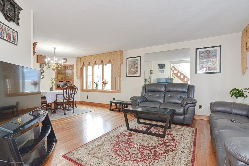 16 Rosedale Avenue Everett, MA 02149 - Photo 4 of 29 a living room with furniture and wooden floor