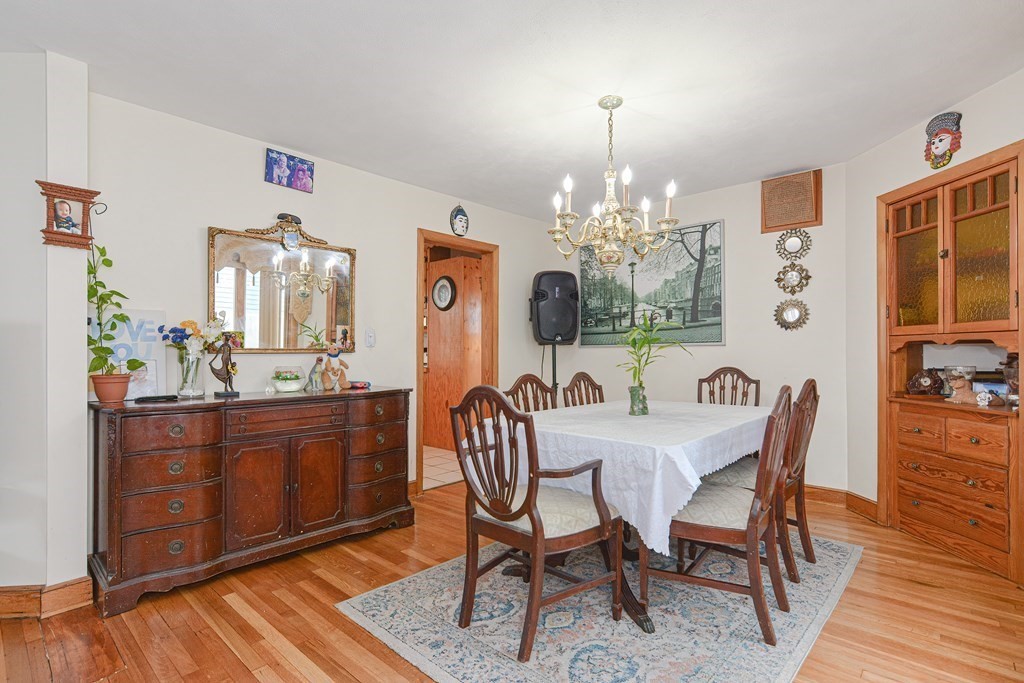 16 Rosedale Avenue Everett, MA 02149 - Photo 9 of 29 a view of a dining room with furniture and chandelier