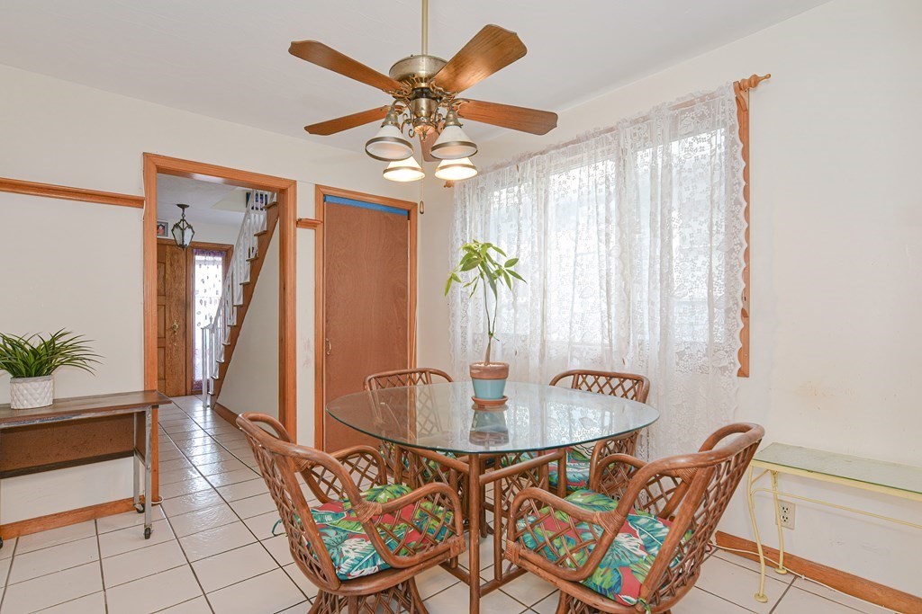 16 Rosedale Avenue Everett, MA 02149 - Photo 10 of 29 a view of a dining room with furniture and chandelier