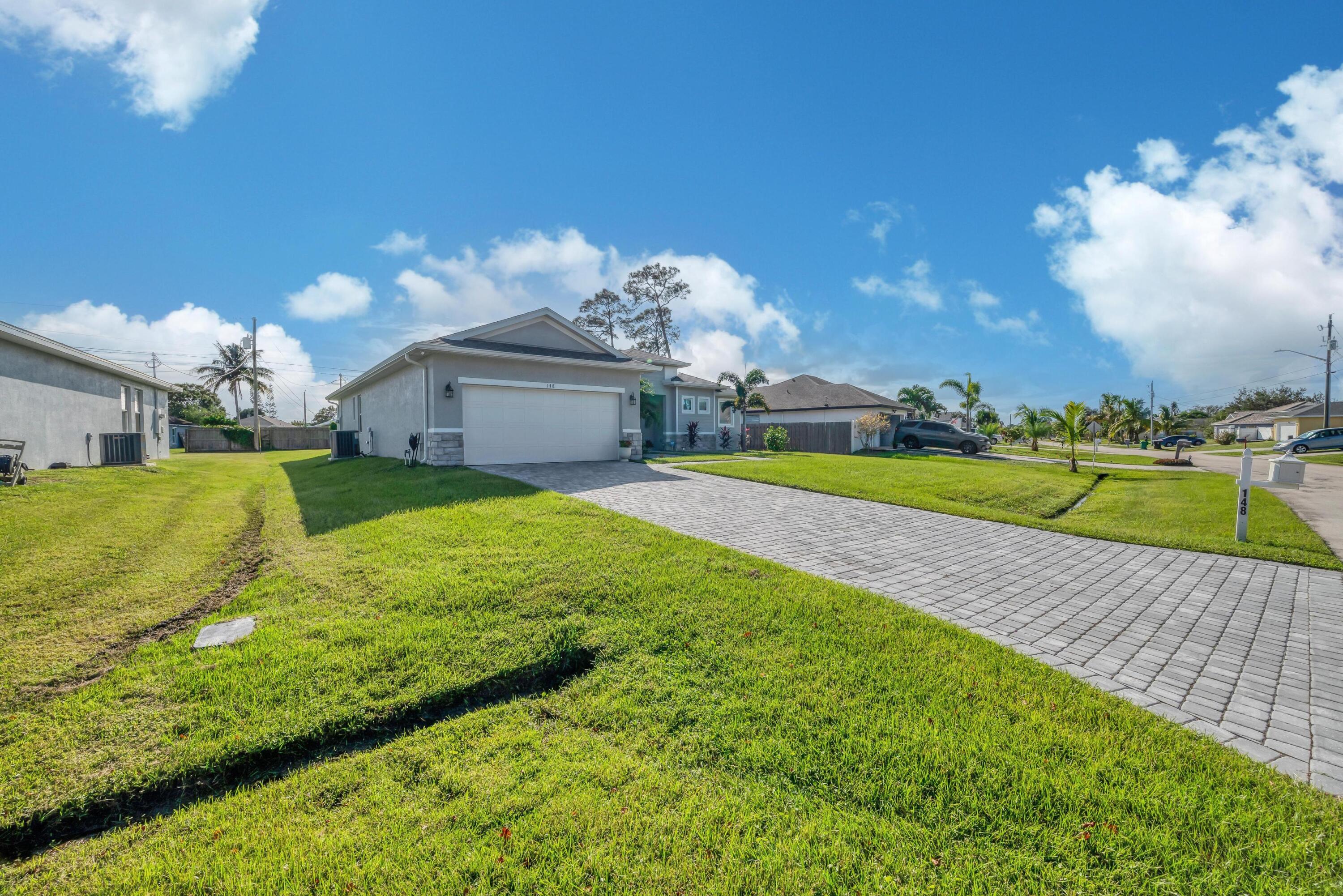 148 Southwest Sea Lion Road Port St. Lucie, FL 34953 - Photo 3 of 42 Driveway