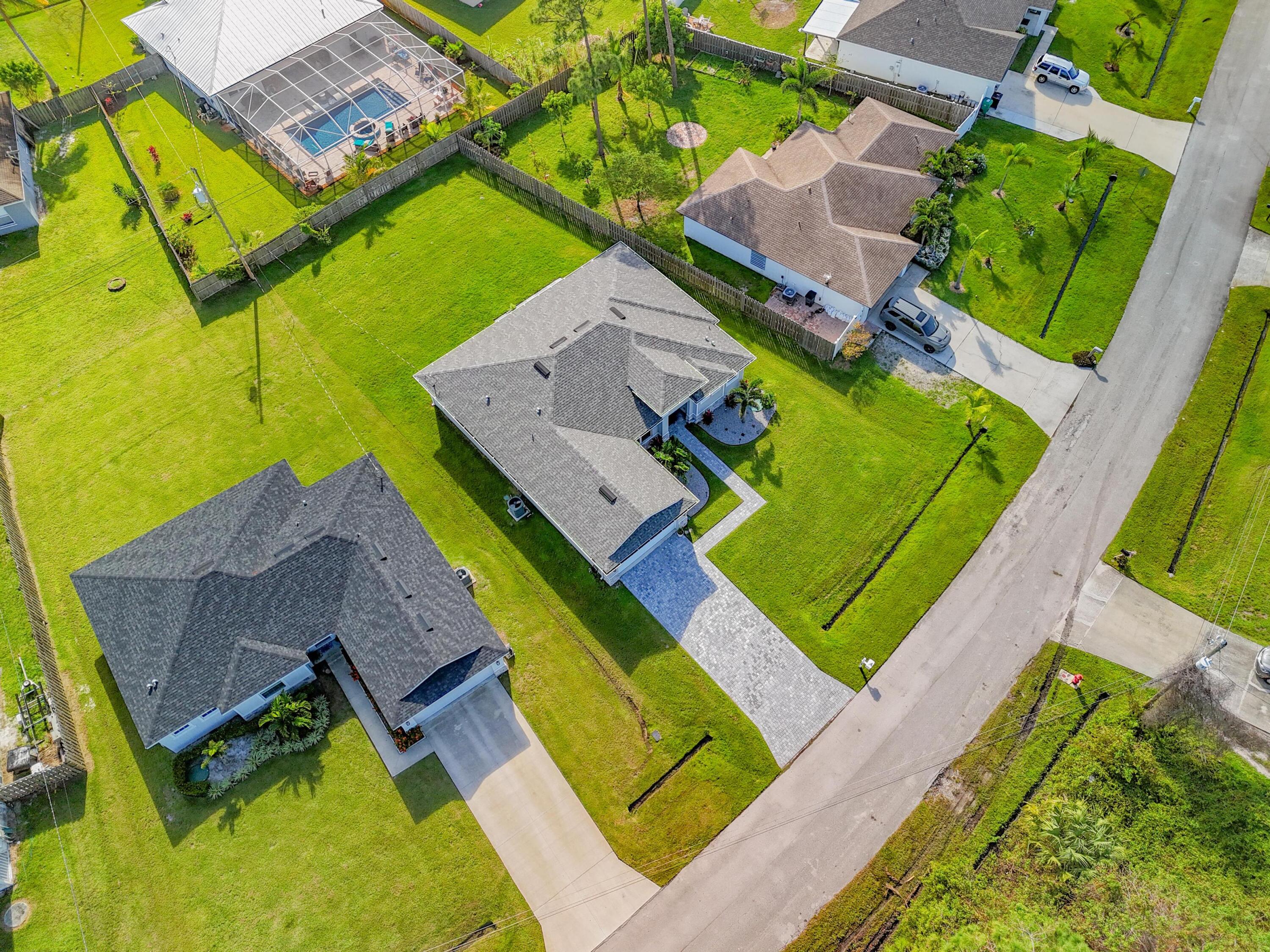 148 Southwest Sea Lion Road Port St. Lucie, FL 34953 - Photo 39 of 42 dji_fly_20241023_153644_0341_17297869068