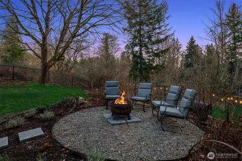 a front view of a house with a garden and garage