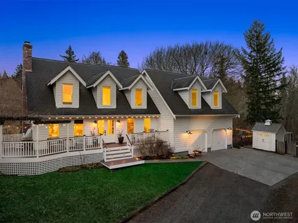 a view of a lake with a forest