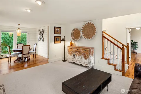 a view of a dining room with furniture window and wooden floor