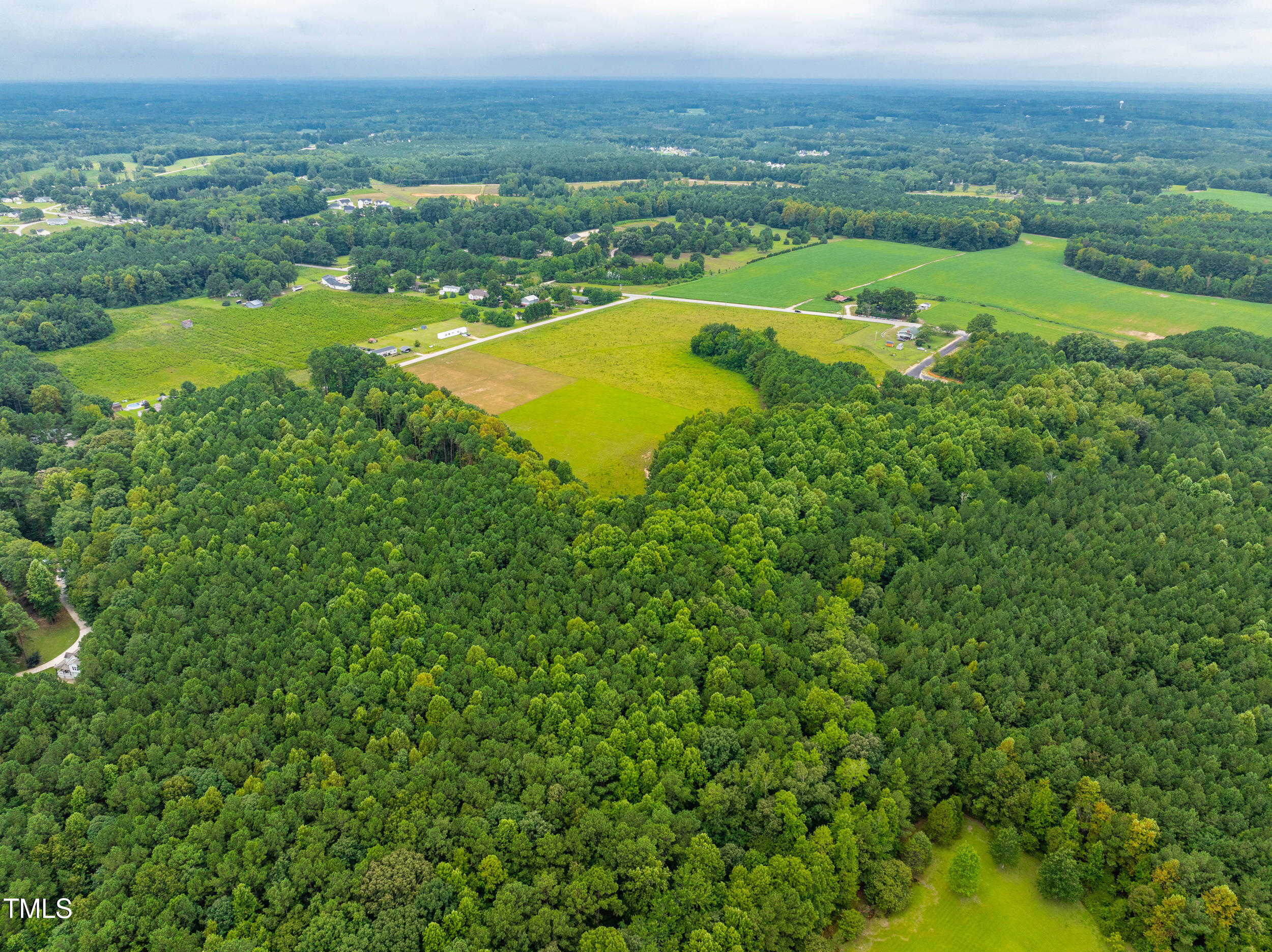 63 Rice Road Zebulon, NC 27597 - Photo 16 of 22 an aerial view of a residential houses with outdoor space and trees all around
