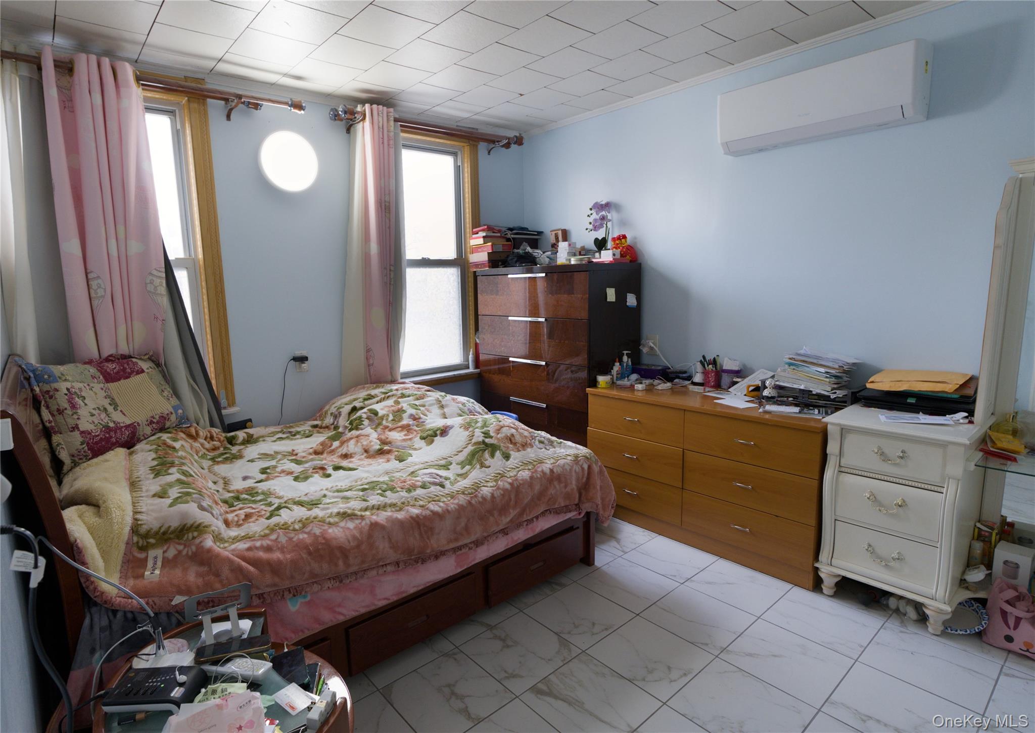 86-24 79th Street Queens, NY 11421 - Photo 16 of 31 a bedroom with a bed and a dresser