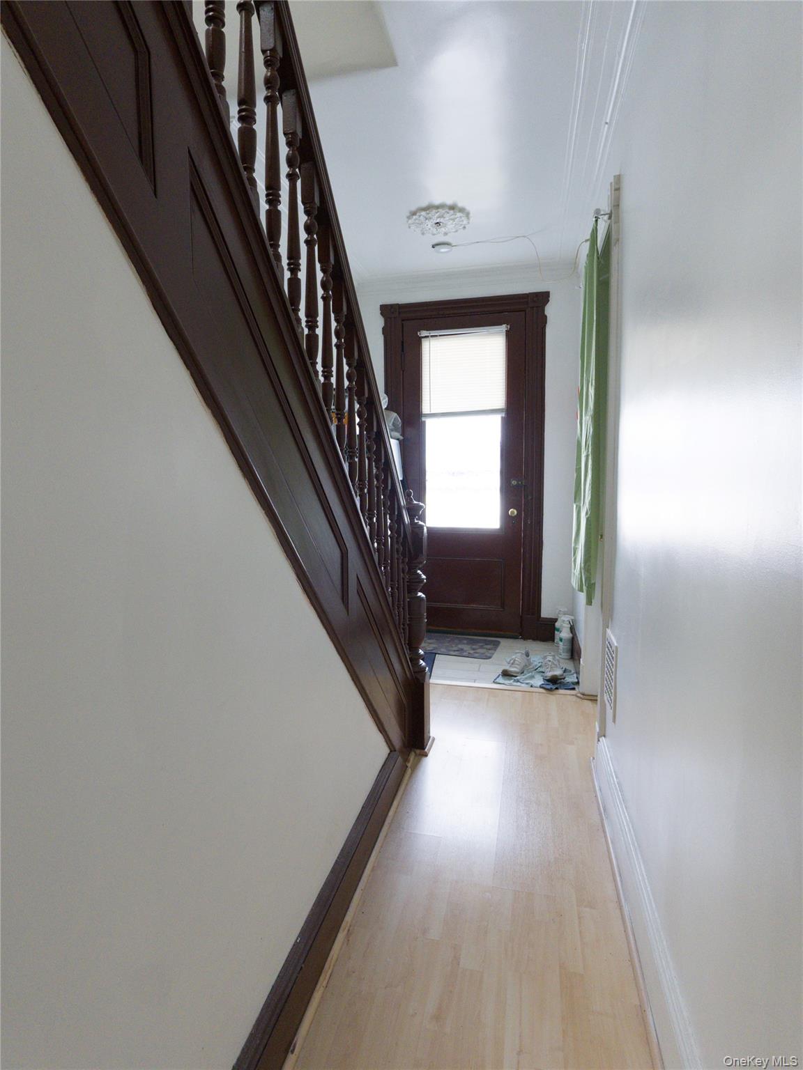 86-24 79th Street Queens, NY 11421 - Photo 20 of 31 a view of staircase with wooden floor and stairs