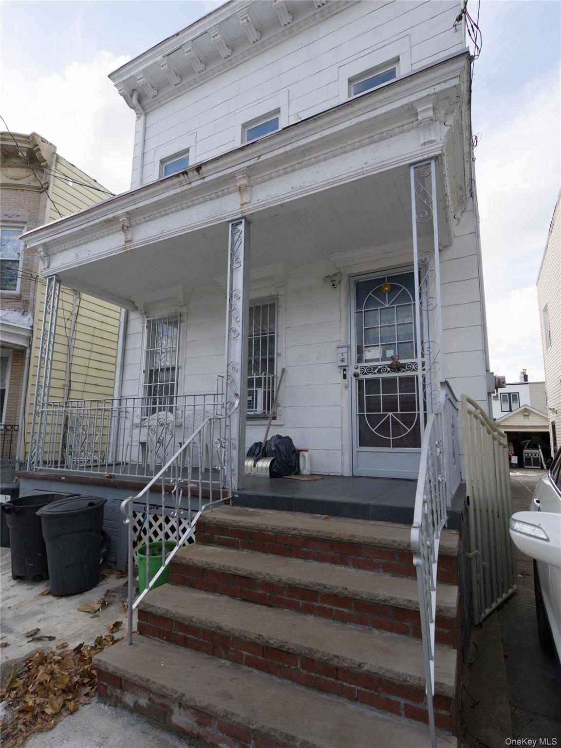 86-24 79th Street Queens, NY 11421 - Photo 27 of 31 a view of a balcony with a floor to ceiling window and stairs
