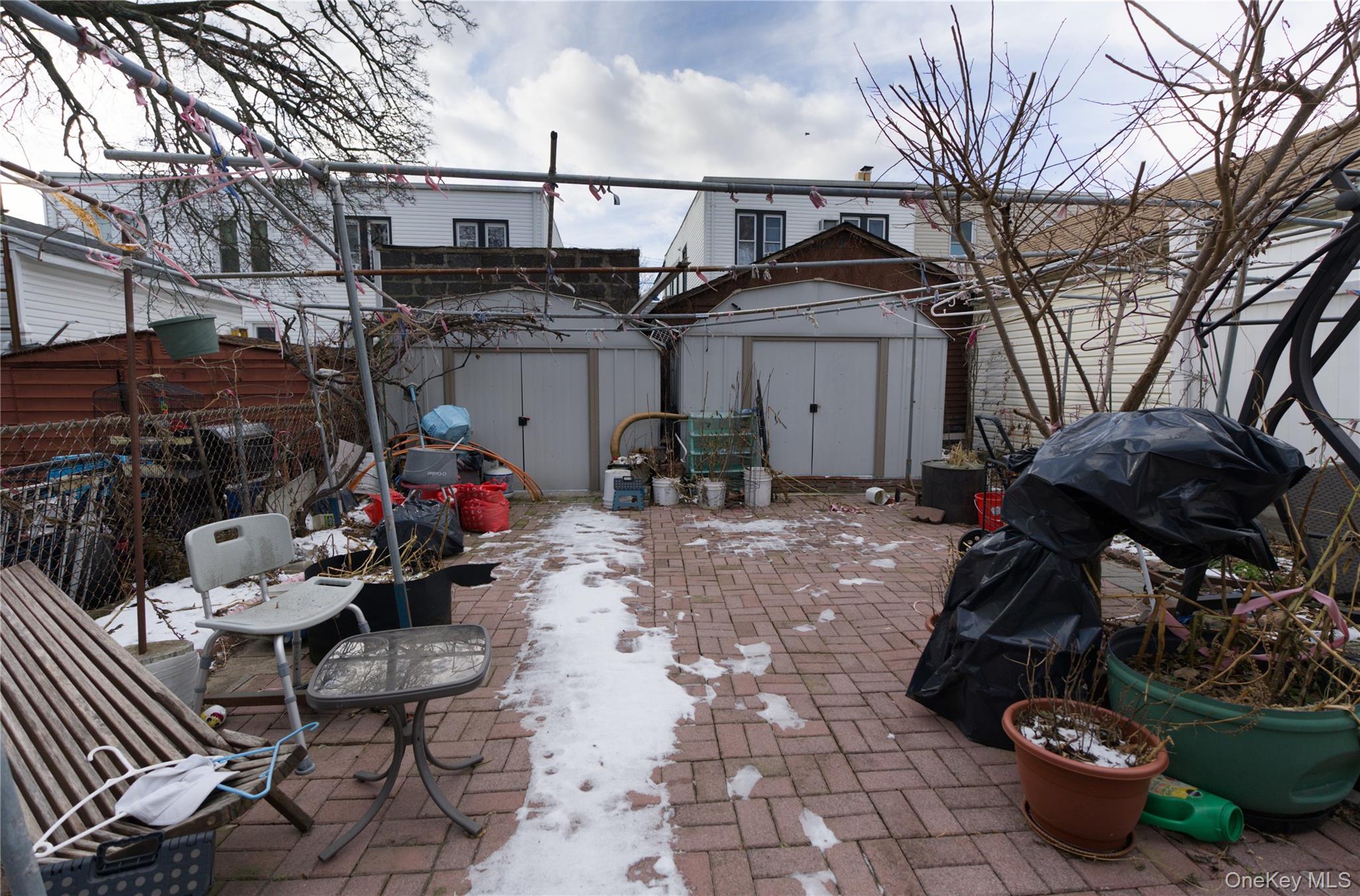 86-24 79th Street Queens, NY 11421 - Photo 28 of 31 a view of a chairs and tables in the patio