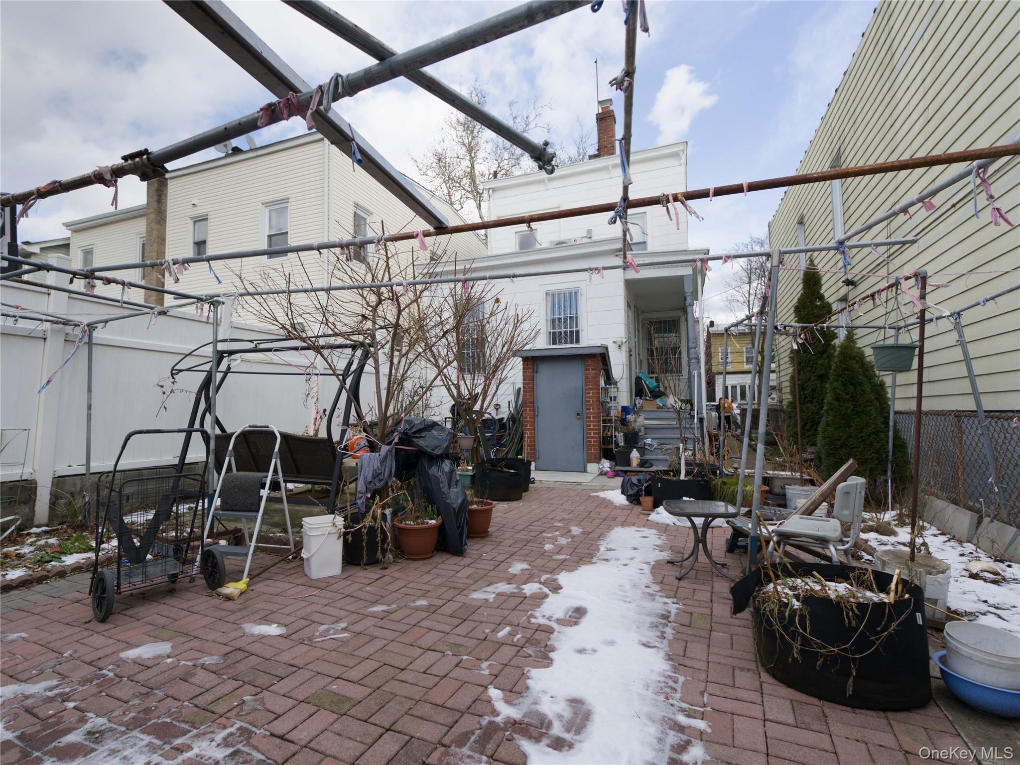 86-24 79th Street Queens, NY 11421 - Photo 29 of 31 a view of a chairs and table in the patio