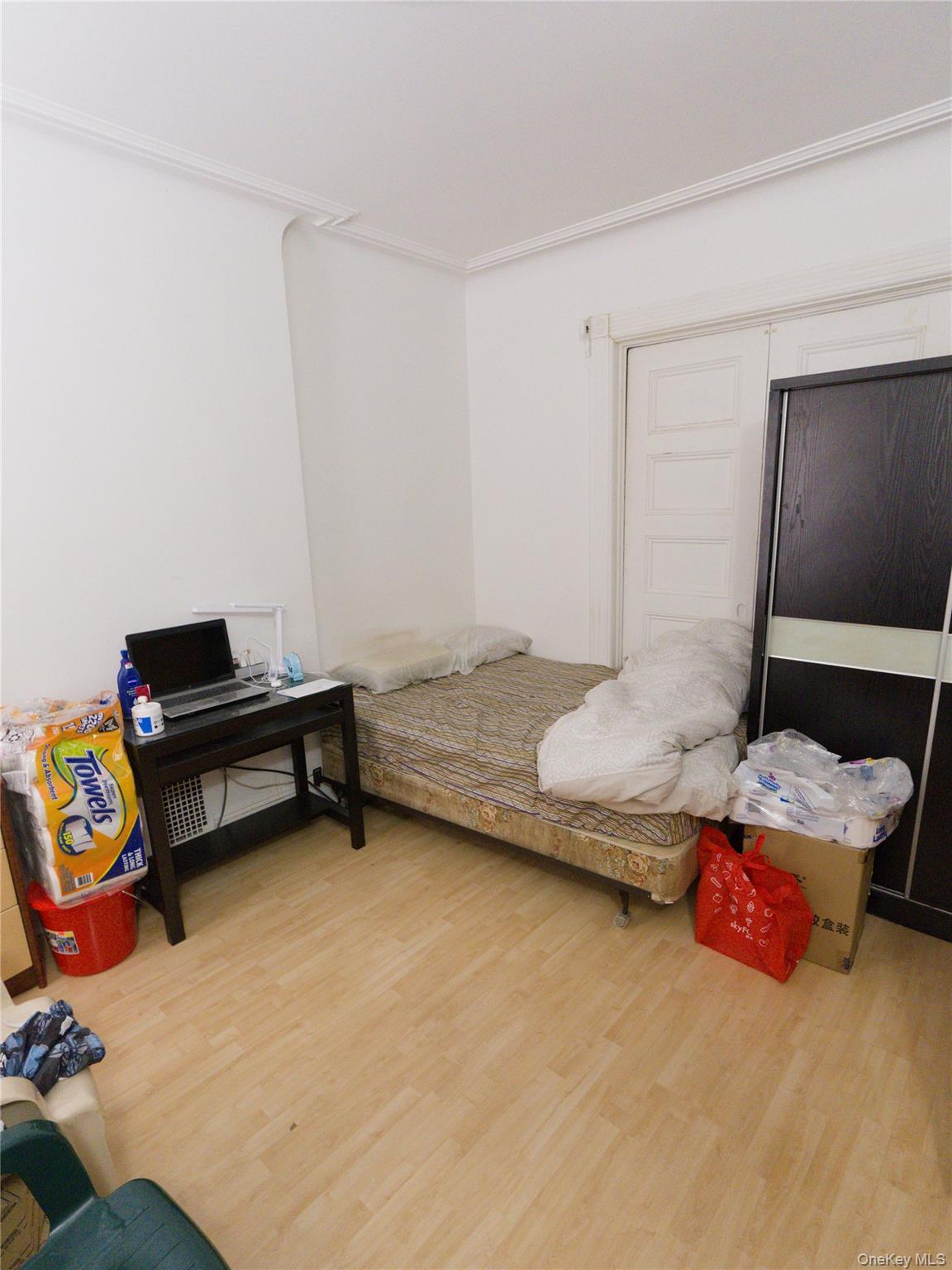 86-24 79th Street Queens, NY 11421 - Photo 5 of 31 a bedroom with furniture and a couch