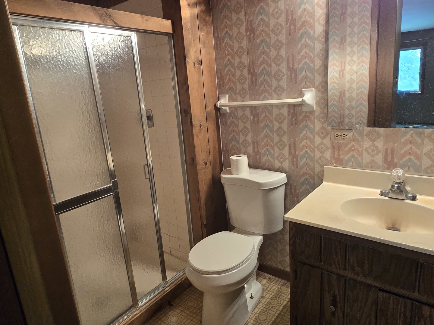 1484 Stonebridge Circle, Unit B12 Wheaton, IL 60189 - Photo 6 of 9 a white toilet sitting next to a bathroom sink