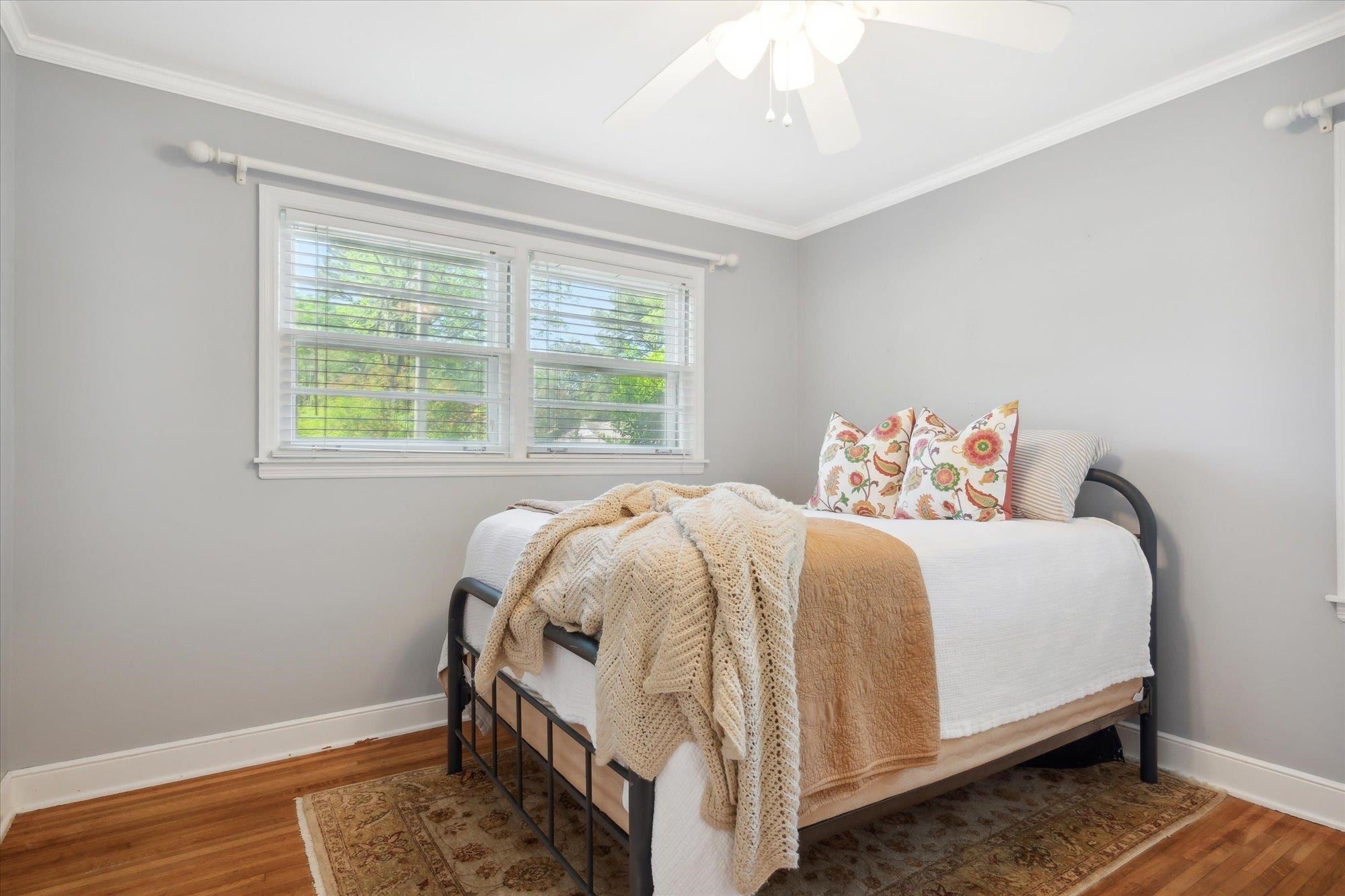336 McElroy Road Memphis, TN 38120 - Photo 13 of 26 Bedroom with dark hardwood / wood-style flooring, ornamental molding, and ceiling fan